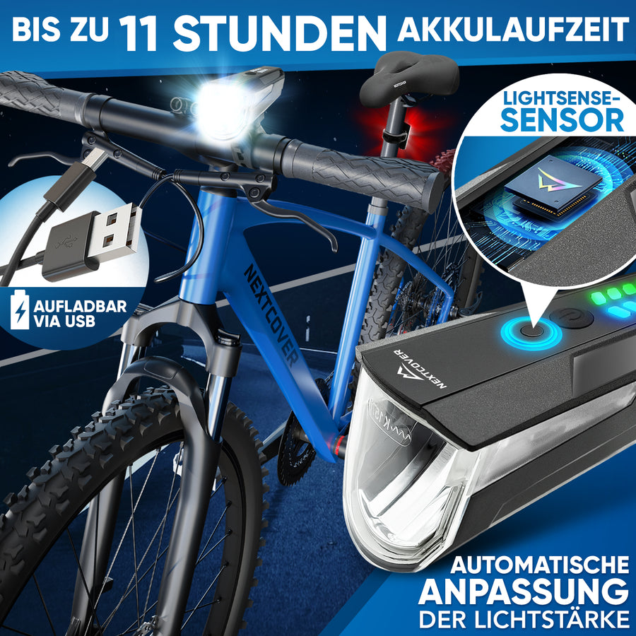Nextcover LED-Fahrradlicht am blauen Mountainbike mit bis zu 11 Stunden Akkulaufzeit, USB-aufladbar und automatischer Lichtstärke-Anpassung durch LightSense-Sensor für optimale Nachtsicht.